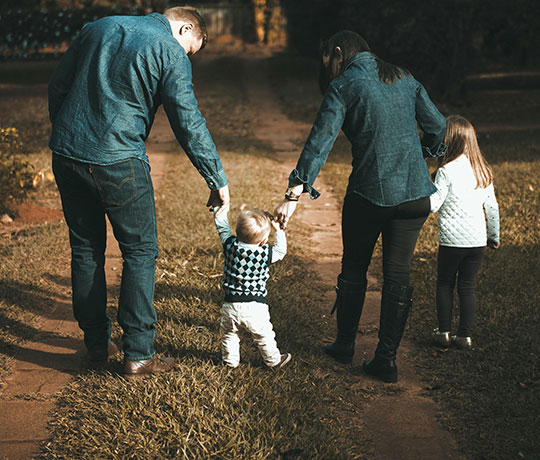 A young family going on a walk