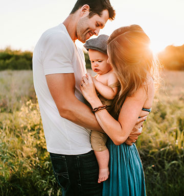 A young family spending time together in a field